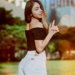 woman wearing black off-shoulder top