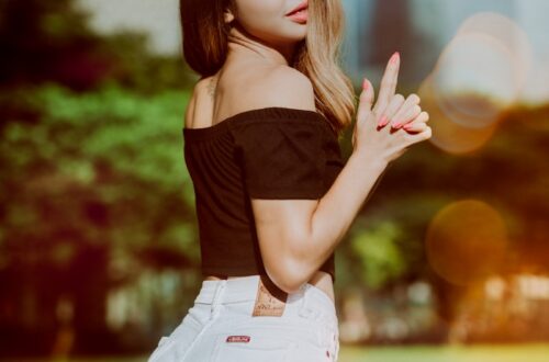 woman wearing black off-shoulder top